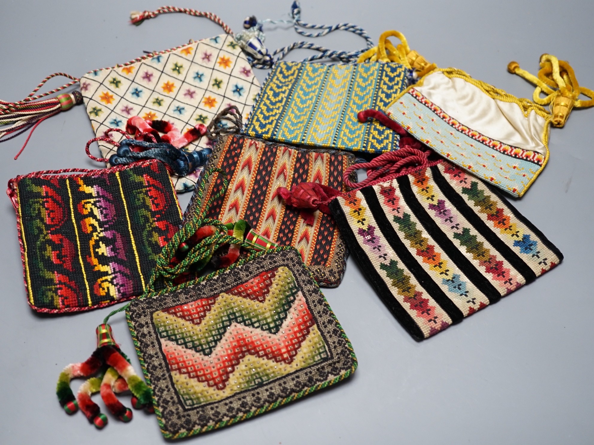 Ten 19th century embroidered and woolworked bible bags, largest 18 x 16cm